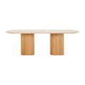Table à manger ovale sculpturale en travertin avec piètement piédestal aux formes douces pour salles à manger